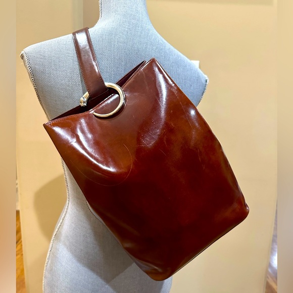 Cartier Handbags - Cartier brown patent leather Panthere sling backpack